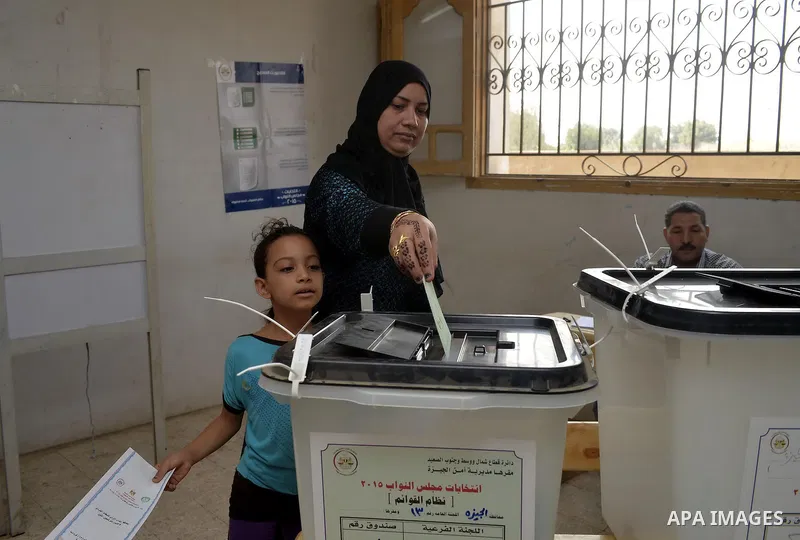 Egyptians participate in the election voting at a polling station in Giza governorate, Egypt, October 18, 2015. Egypt's long-awaited parliamentary election got off to a slow start on Sunday, marking the final step in a p...