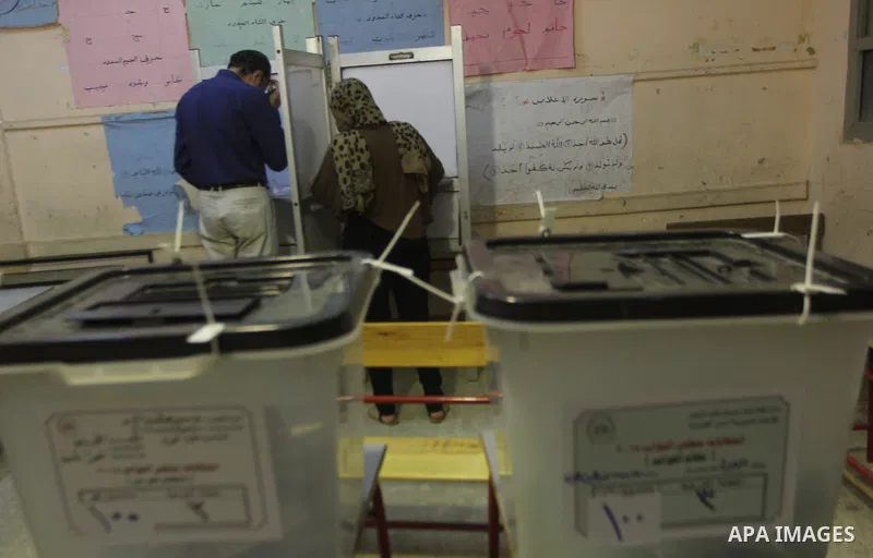 An Egyptian man casts his ballot in the Egyptian parliamentary elections at a polling station in Cairo, on October 18, 2015. Polling opened earlier in the day in Egypt to elect a new parliament that will tighten Presiden...