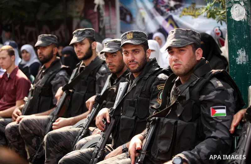 Palestinian policemen take part in a protest demanding release the prisoners in Israeli jails, in front of Red cross office, in Gaza city, on Oct. 19, 2015. Photo by Ashraf Amra