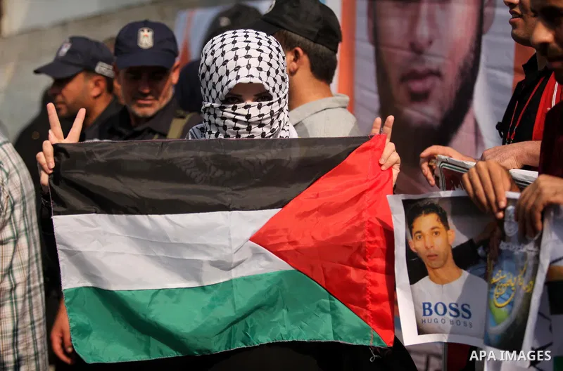 A Palestinian woman takes part in an anti-Israel protest in front of Red cross office, in Gaza city, on Oct. 19, 2015. Israel pressed ahead with major security measures after five more stabbing incidents, while ultra-Ort...