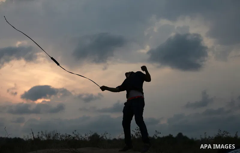 Palestinian protesters clash with Israeli troops near the border between Israel and Central Gaza Strip October 19, 2015. More than two weeks of unrest have raised warnings of the risk of a full-scale Palestinian uprising...