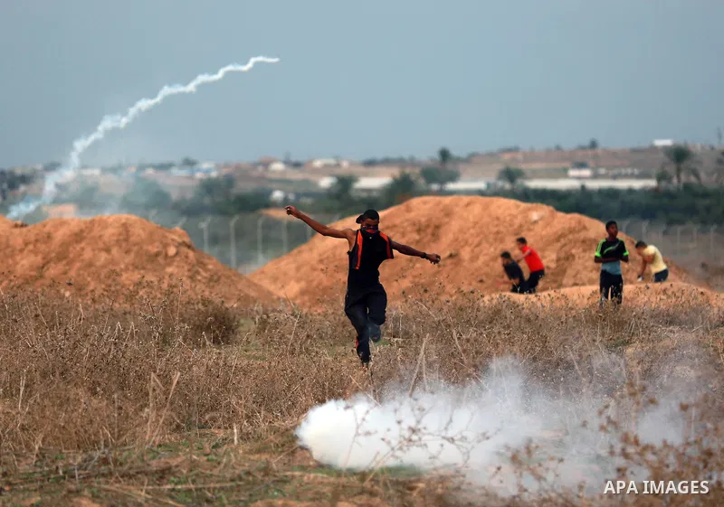 Palestinian protesters clash with Israeli troops near the border between Israel and Central Gaza Strip October 19, 2015. More than two weeks of unrest have raised warnings of the risk of a full-scale Palestinian uprising...