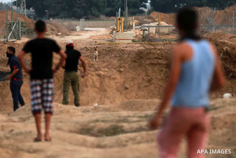 Palestinian protesters clash with Israeli troops near the border between Israel and Central Gaza Strip October 19, 2015. More than two weeks of unrest have raised warnings of the risk of a full-scale Palestinian uprising...