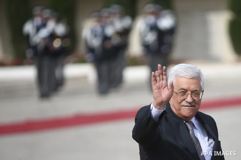 Palestinian president Mahmoud Abbas waves to media while awaiting the arrival of his Republic of Lithuania counterpart, Dalia Grybauskaite to the West Bank city of Ramallah on October 20, 2015. Photo by Fadi Arouri / POO...
