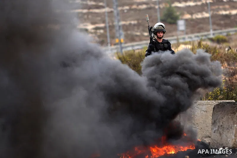Israeli security forces take postion during clashes with Palestinian protesters near the Jewish settlement of Beit El, near Ramallah on October 23, 2015. Palestinian factions called for mass rallies against Israel in the...