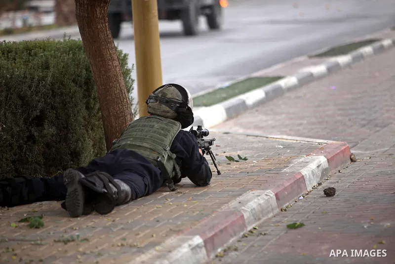 A member of Israeli security forces takes position during clashes with Palestinian protesters near the Jewish settlement of Beit El, near Ramallah on October 23, 2015. Palestinian factions called for mass rallies against...