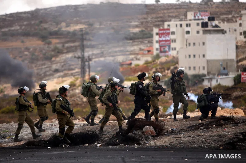 Israeli security forces take postion during clashes with Palestinian protesters near the Jewish settlement of Beit El, near Ramallah on October 23, 2015. Palestinian factions called for mass rallies against Israel in the...