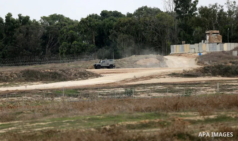 Israeli security forces take position during clashes with Palestinian protesters near the border between Israeli and central Gaza Strip, on October 23, 2015. Palestinian factions called for mass rallies against Israel in...