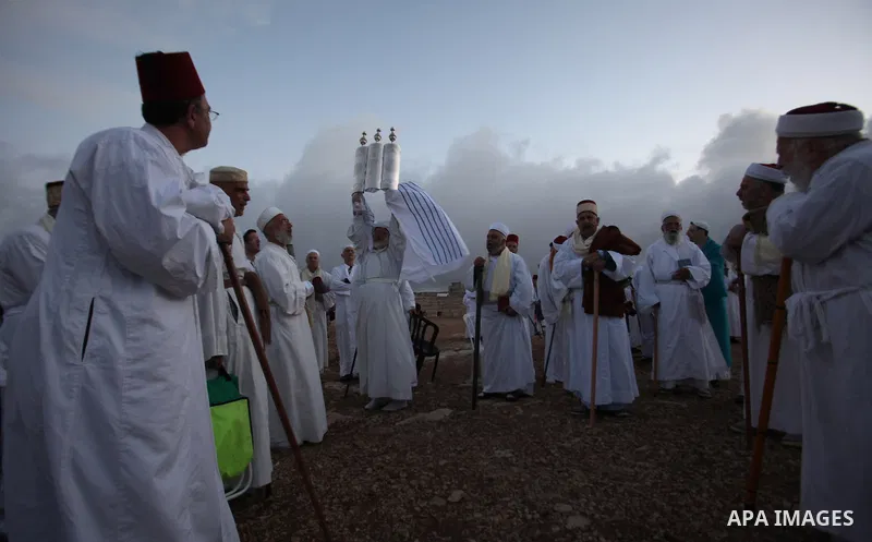 Samaritans pray on top of Mount Gerizim near the northern West Bank city of Nablus on October 27, 2015 during Sukkot (Tabernacles) celebrations. Sukkot marks the exodus of the ancient Hebrew people from Egypt. The Samari...