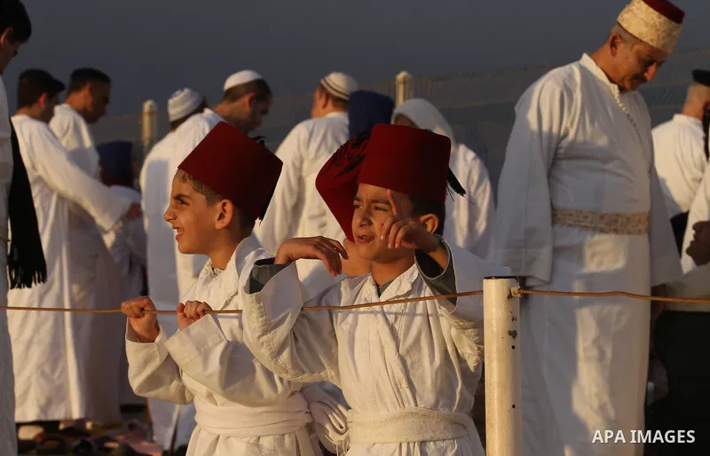Samaritans pray on top of Mount Gerizim near the northern West Bank city of Nablus on October 27, 2015 during Sukkot (Tabernacles) celebrations. Sukkot marks the exodus of the ancient Hebrew people from Egypt. The Samari...
