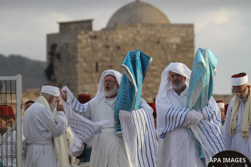 Samaritans pray on top of Mount Gerizim near the northern West Bank city of Nablus on October 27, 2015 during Sukkot (Tabernacles) celebrations. Sukkot marks the exodus of the ancient Hebrew people from Egypt. The Samari...