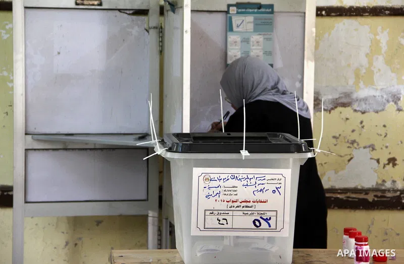 An Egyptian woman casts her ballot at a polling station in Cairo, as voters returned to polling stations on October 27, 2015 for a first round run-off in a parliamentary vote expected to elect lawmakers firmly backing Pr...