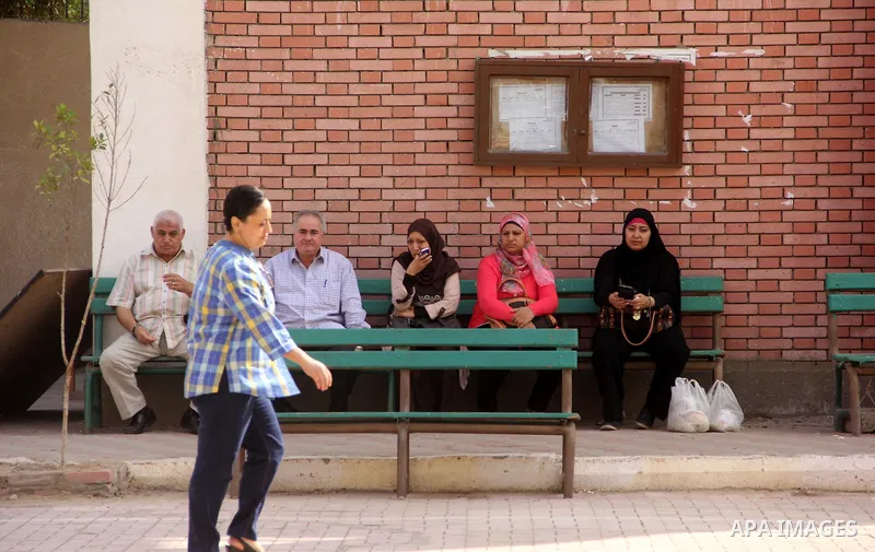 Egyptians cast their ballot at a polling station in Cairo, as voters returned to polling stations on October 27, 2015 for a first round run-off in a parliamentary vote expected to elect lawmakers firmly backing President...