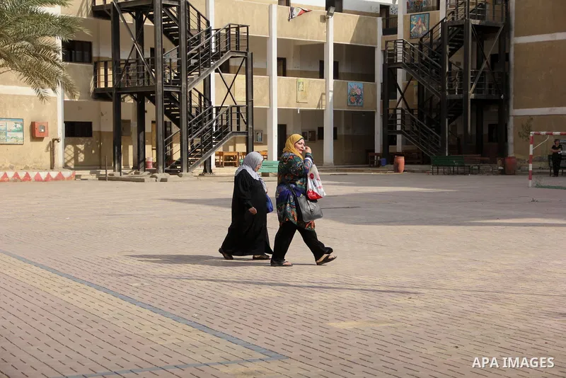 An Egyptian woman casts her ballot at a polling station in Cairo, as voters returned to polling stations on October 27, 2015 for a first round run-off in a parliamentary vote expected to elect lawmakers firmly backing Pr...