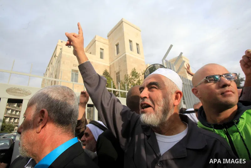 Leader of the radical northern wing of the Islamic Movement in Israel, Sheikh Raed Salah, gestures outside a Jerusalem court after he was convicted on October 27, 2015. An Israeli court upheld a conviction of the firebra...