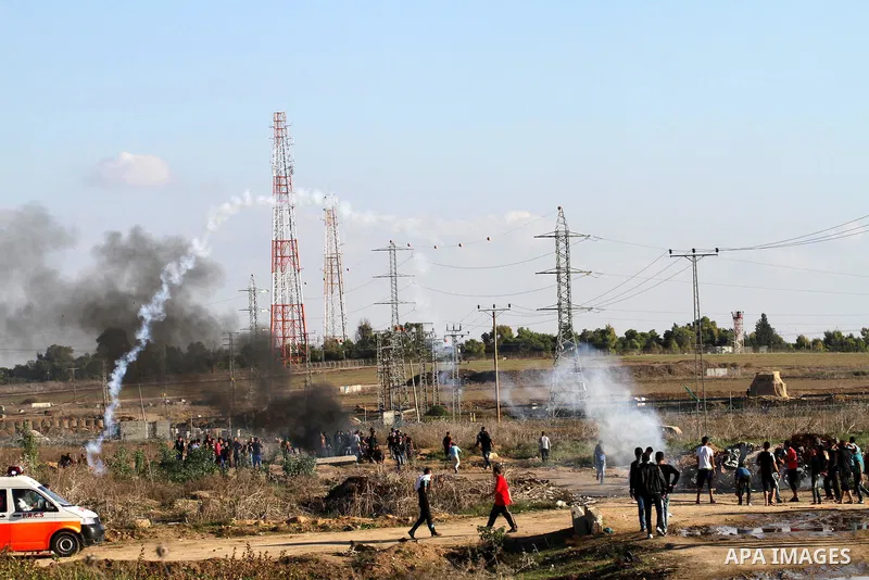 Palestinian protesters take part in clashes with Israeli troops near the border between Israel and eastern Gaza city, October 30, 2015. Since the start of October, violence that has included stabbings as well as clashes...