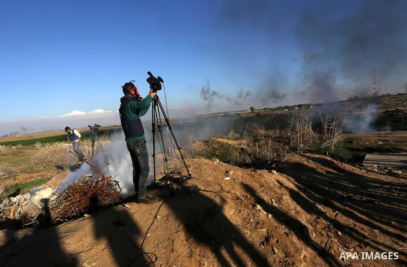 Palestinian protesters take part in clashes with Israeli troops near the border between Israel and eastern Gaza city, October 30, 2015. Since the start of October, violence that has included stabbings as well as clashes...
