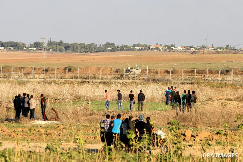 Palestinian protesters take part in clashes with Israeli troops near the border between Israel and eastern Gaza city, October 30, 2015. Since the start of October, violence that has included stabbings as well as clashes...