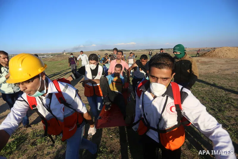 Palestinian protesters take part in clashes with Israeli troops near the border between Israel and central Gaza strip, October 30, 2015. Since the start of October, violence that has included stabbings as well as clashes...