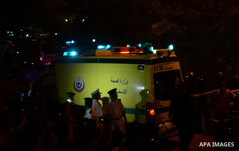 Police officers make way for ambulances with bodies of Russian plane crash victims outside Zeinhom morgue in Cairo, Egypt, Saturday, Oct. 31, 2015. A Russian aircraft carrying 224 people, including 17 children, crashed S...