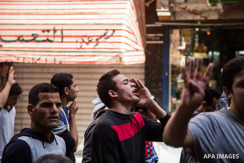 Egyptian supporters of Muslim Brotherhood shot slogans during a demonstration in support of deposed President Mohamed Morsi, in Giza near Cairo, November 6, 2015. Photo by Amr Sayed