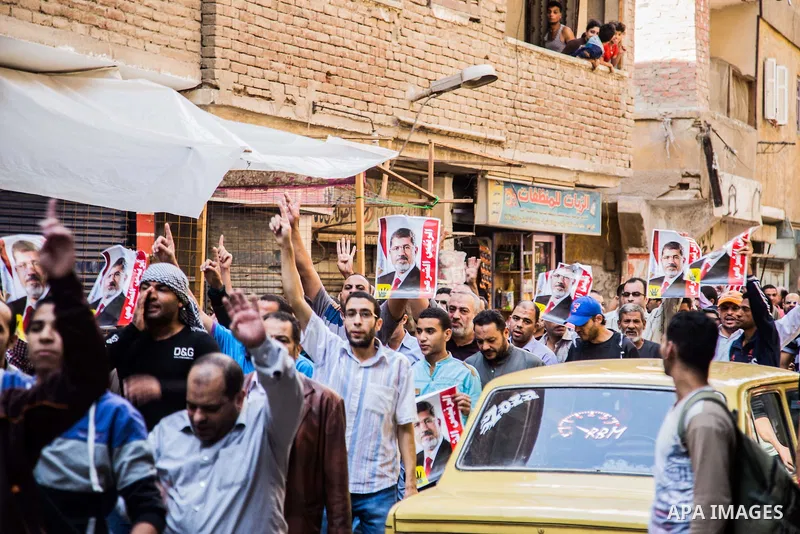 Egyptian supporters of Muslim Brotherhood shot slogans during a demonstration in support of deposed President Mohamed Morsi, in Giza near Cairo, November 6, 2015. Photo by Amr Sayed