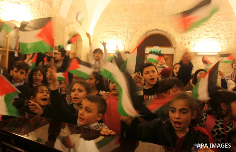 Palestinian children perform during a national festival coinciding with West bank, Palestinian territories occupied, and some of Arab and European countries in Jerusalem's old city on Nov. 07, 2015. Photo by Mahfouz Abu...