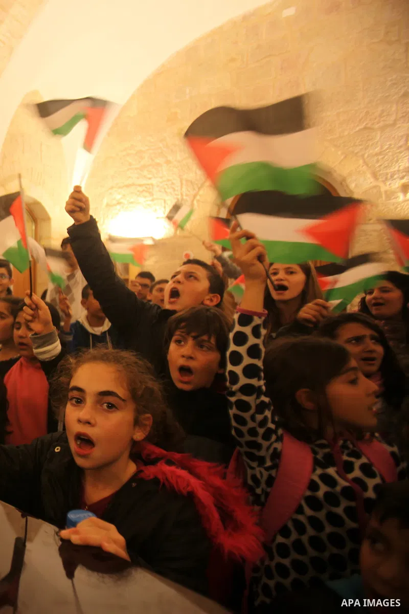 Palestinian children perform during a national festival coinciding with West bank, Palestinian territories occupied, and some of Arab and European countries in Jerusalem's old city on Nov. 07, 2015. Photo by Mahfouz Abu...