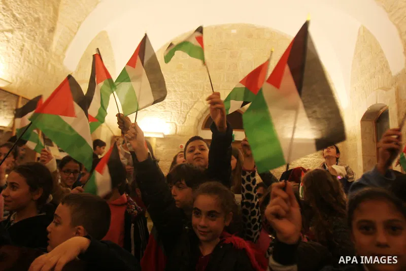 Palestinian children perform during a national festival coinciding with West bank, Palestinian territories occupied, and some of Arab and European countries in Jerusalem's old city on Nov. 07, 2015. Photo by Mahfouz Abu...