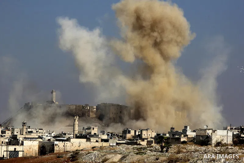 Smoke billows following a reported airstrike by government forces next to the Aleppo Citadel in the northern Syrian city on November 7, 2015. More than 250,000 people have died in Syria's conflict, which several rounds o...