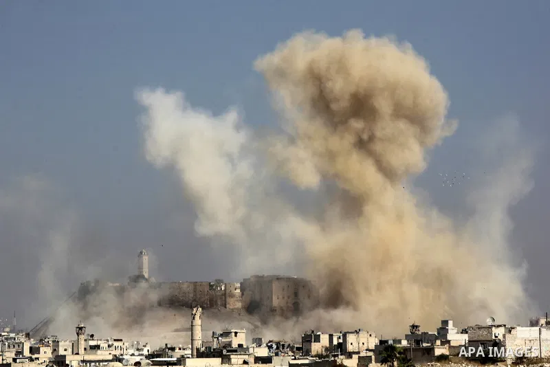 Smoke billows following a reported airstrike by government forces next to the Aleppo Citadel in the northern Syrian city on November 7, 2015. More than 250,000 people have died in Syria's conflict, which several rounds o...
