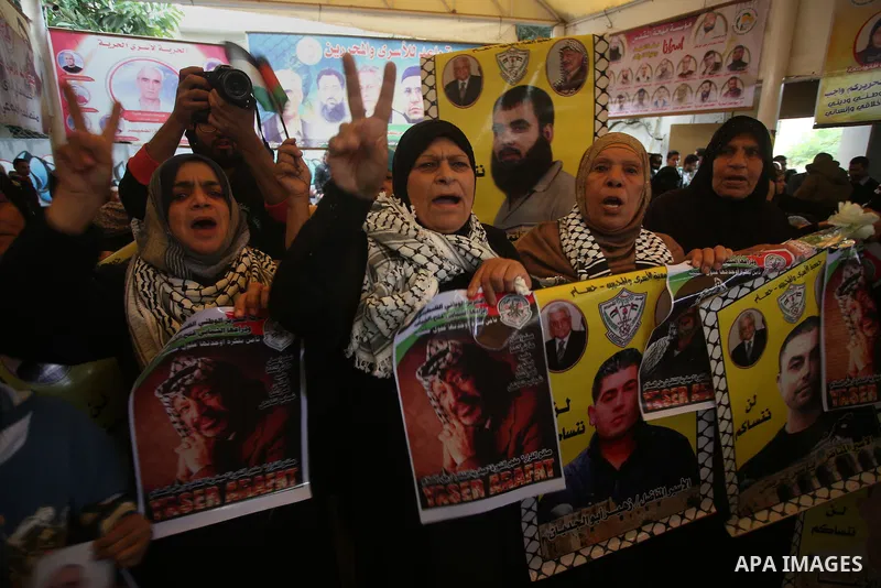 Palestinians take part in a protest demanding release the prisoners in Israeli jails, in front of Red cross office, in Gaza city, on Nov. 09, 2015. Photo by Mohammed Asad