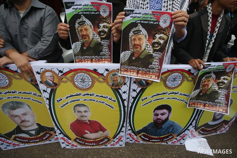 Palestinians take part in a protest demanding release the prisoners in Israeli jails, in front of Red cross office, in Gaza city, on Nov. 09, 2015. Photo by Mohammed Asad