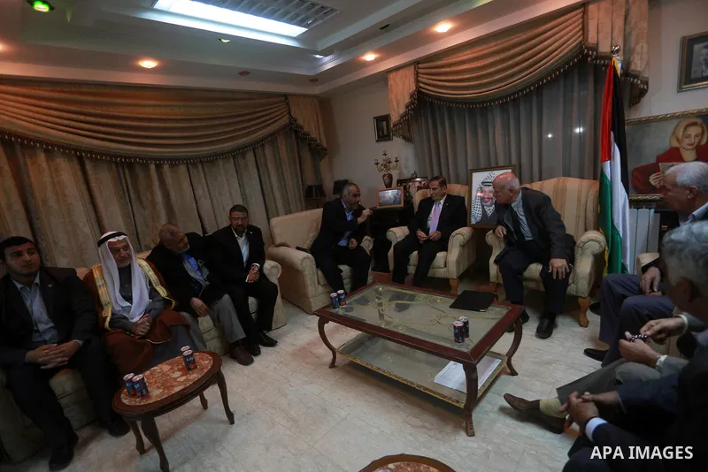 Palestinian leaders of Hamas and Fatah movements attend a meeting to handover the house of late Palestinian leader Yasser Arafat, in Gaza city on November 10, 2011. A Fatah spokesperson said that an agreement had been re...