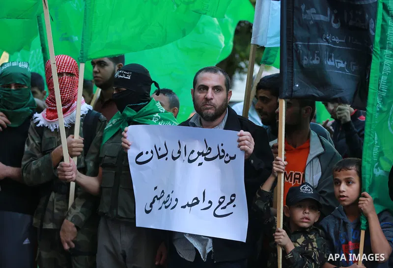 Palestinian Hamas supporters take part in a protest against the killing in twin suicide attacks 12 November in the Bourj al-Barajneh suburb of Beirut, in Gaza city on November 13, 2015. Photo by Stringer