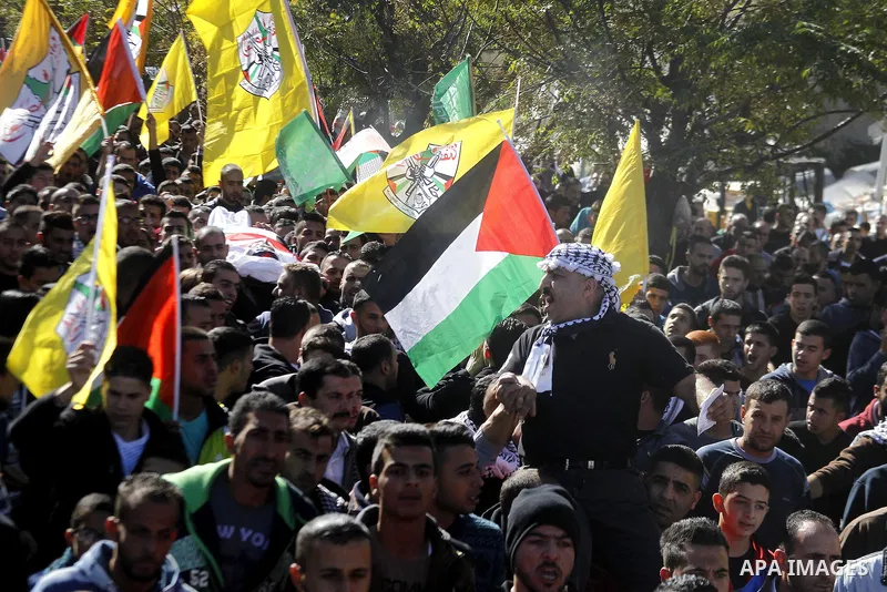 Palestinians carry the body of 23 year old Hassan Al-Baw, who was killed in clashes with Israeli forces, during his funeral in the West Bank village of Halhul, near Hebron, Saturday, Nov. 14, 2015. Photo by Wisam Hashlam...