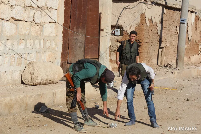 Fighters from the Free Syrian Army patrol the area following clashes with the pro-regime forces in the northern Syrian city of Aleppo, on November 14, 2015. Parties to Syrian peace talks agreed on Saturday to accelerate...