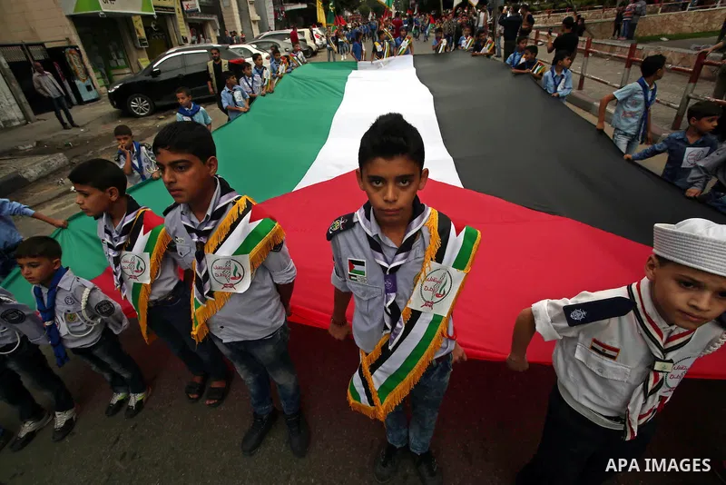 Palestinian scouts play music during a march to mark the 27th anniversary of the Palestinian Independence Day, in Gaza city, on Nov. 15, 2015. Palestinians have marked Nov. 15 as their Independence Day since 1988 when th...