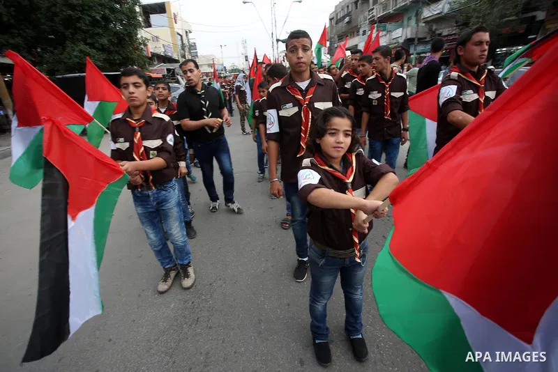 Palestinian scouts play music during a march to mark the 27th anniversary of the Palestinian Independence Day, in Gaza city, on Nov. 15, 2015. Palestinians have marked Nov. 15 as their Independence Day since 1988 when th...