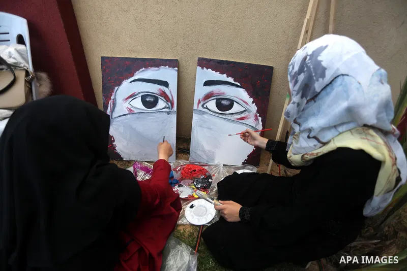Palestinians paint murals during an event to show solidarity with the Palestinians in the West Bank and Jerusalem, in Gaza city on November 18, 2015. The surge in violence across Israel, Jerusalem and the Israeli-occupie...