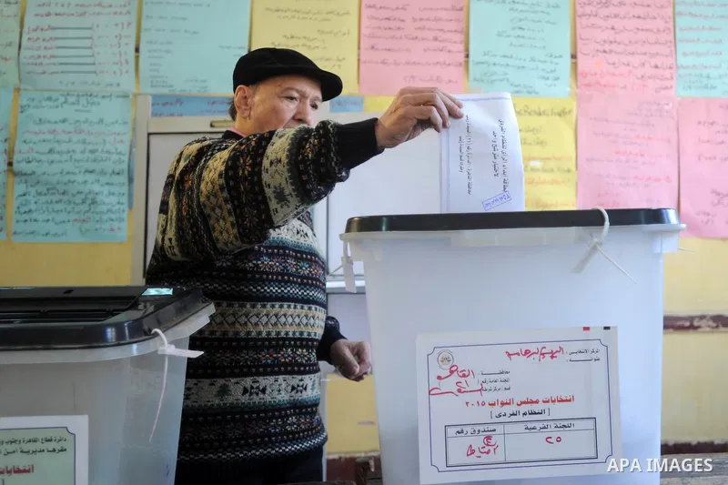 An Egyptian man casts his vote at a polling station during the second round of parliamentary elections in Cairo, Egypt, November 22, 2015. Egyptians voted on Sunday in the second phase of elections that are meant to rest...