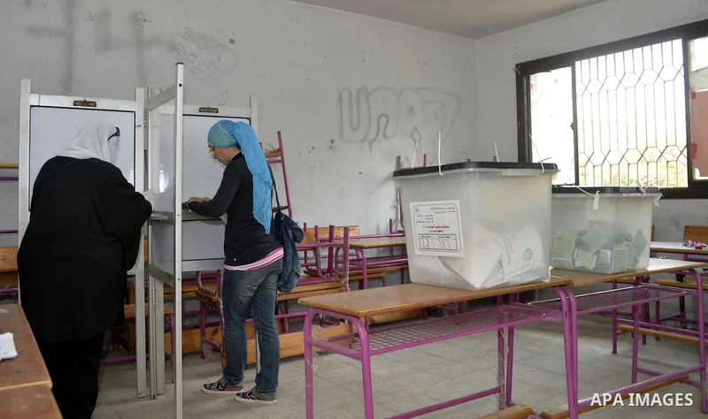 Egyptian women cast their votes at a polling station, on the second day of the final round of the country's parliamentary elections, in the capital Cairo on November 23, 2015. Egyptians are voting across 13 of the countr...