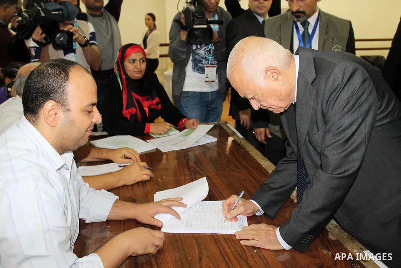 Arab League Secretary-General Nabil Elaraby casts his vote at a polling station, on the second day of the final round of the country's parliamentary elections, in the capital Cairo on November 23, 2015. Egyptians are vot...