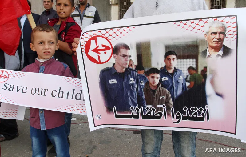 Palestinian supporters of Popular front for Liberation of Palestine (PFLP), take part in a protest in solidarity with jailed Palestinian boy Ahmad Manasrah, in Khan Younis in the southern Gaza Strip, November 26, 2015. T...