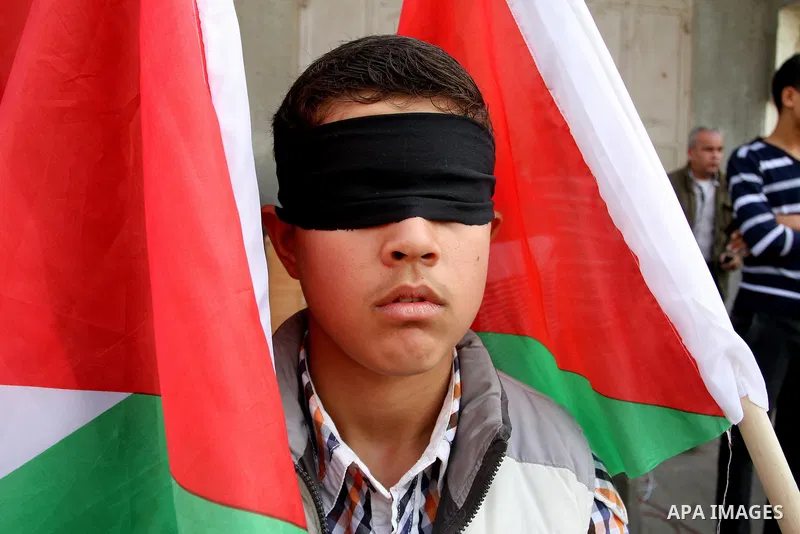 Palestinian supporters of Popular front for Liberation of Palestine (PFLP), take part in a protest in solidarity with jailed Palestinian boy Ahmad Manasrah, in Khan Younis in the southern Gaza Strip, November 26, 2015. T...
