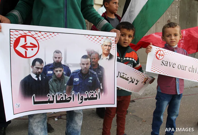 Palestinian supporters of Popular front for Liberation of Palestine (PFLP), take part in a protest in solidarity with jailed Palestinian boy Ahmad Manasrah, in Khan Younis in the southern Gaza Strip, November 26, 2015. T...