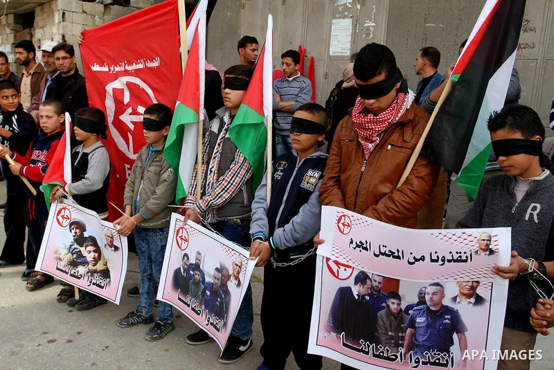 Palestinian supporters of Popular front for Liberation of Palestine (PFLP), take part in a protest in solidarity with jailed Palestinian boy Ahmad Manasrah, in Khan Younis in the southern Gaza Strip, November 26, 2015. T...