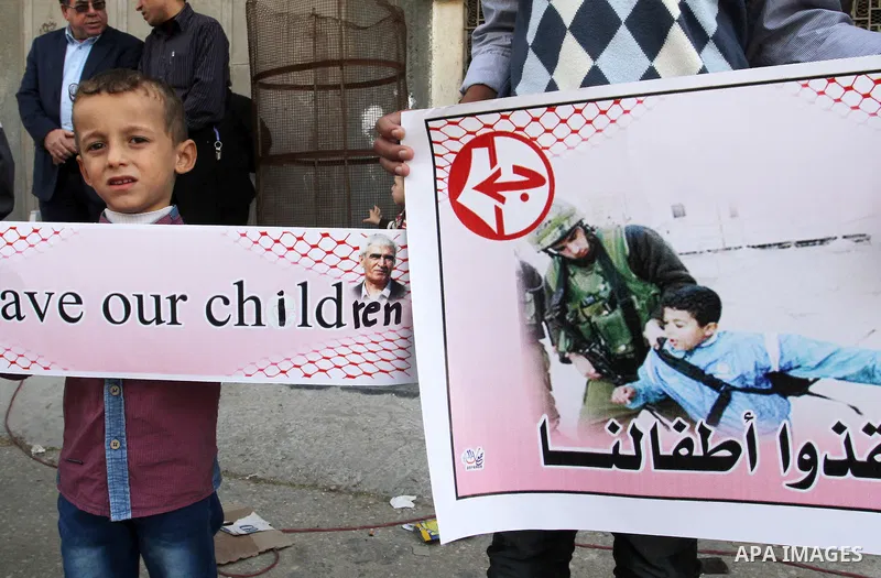 Palestinian supporters of Popular front for Liberation of Palestine (PFLP), take part in a protest in solidarity with jailed Palestinian boy Ahmad Manasrah, in Khan Younis in the southern Gaza Strip, November 26, 2015. T...