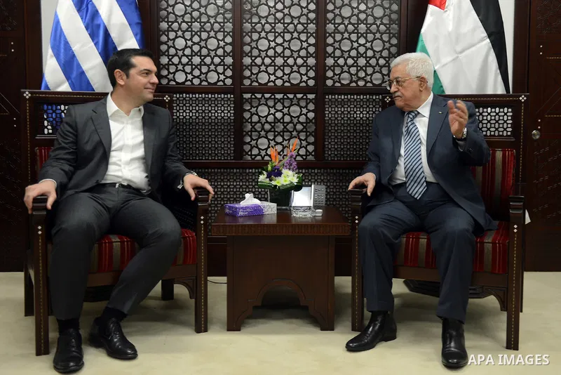 Palestinian President Mahmoud Abbas (R) meets with Greek Prime Minister Alexis Tsipras in the West Bank city of Ramallah November 26, 2015. Photo by Thaer Ganaim