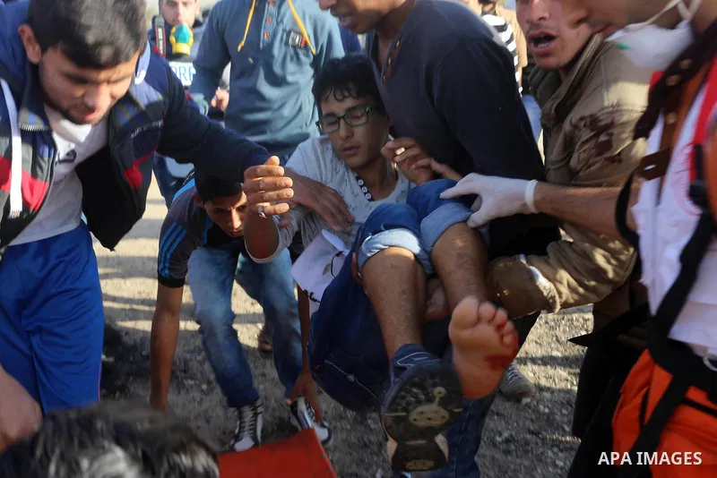 An injured Palestinian protester is evacuated during clashes with Israeli security forces near the border between Israel and the central Gaza Strip, November 27, 2015. The current wave of violence erupted in mid-Septembe...